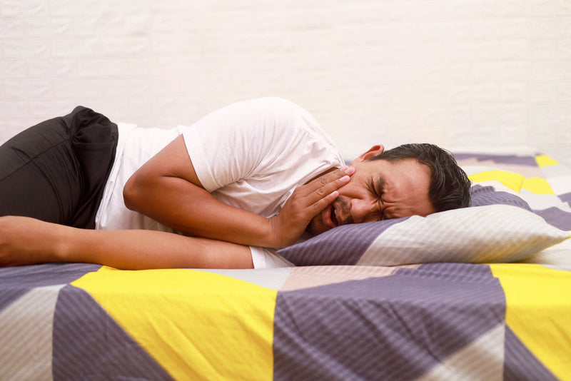 woman sick in bed